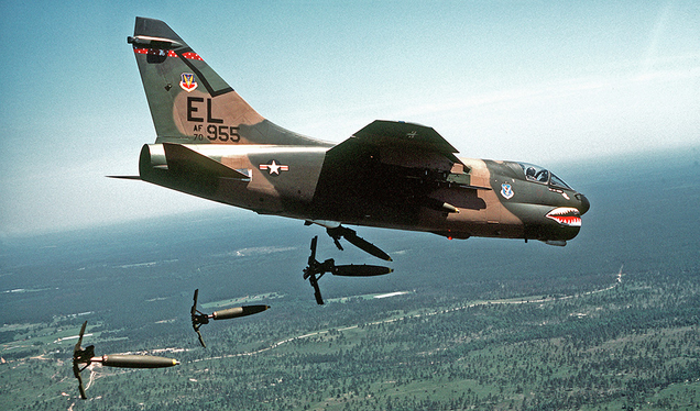 A US Air Force Corsair II drops Mark 82 bombs over a range in Floria